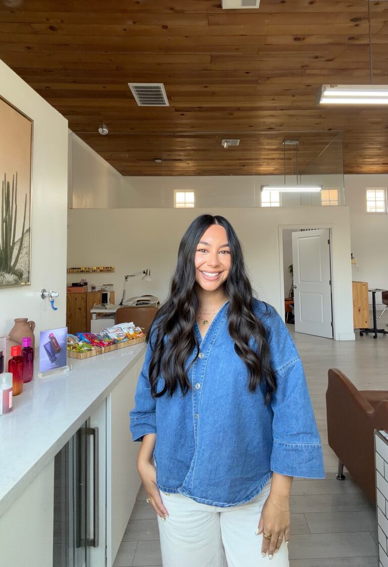 Lexi in a blue shirt with dark hair