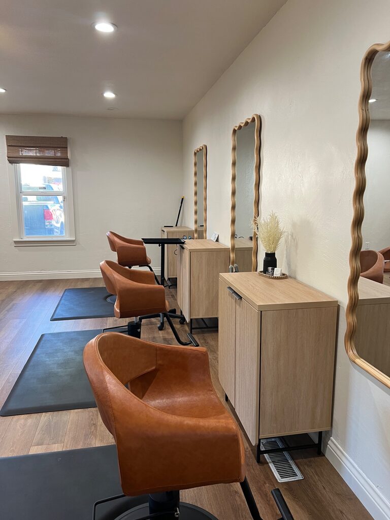 Warm, inviting styling stations inside Valor Hair Studio
